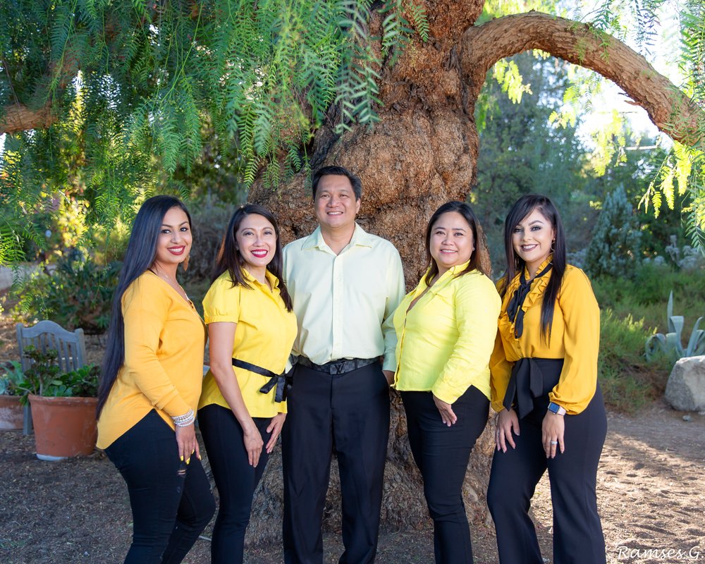 Dr. Garcia and her team in colorful coordinated outfits