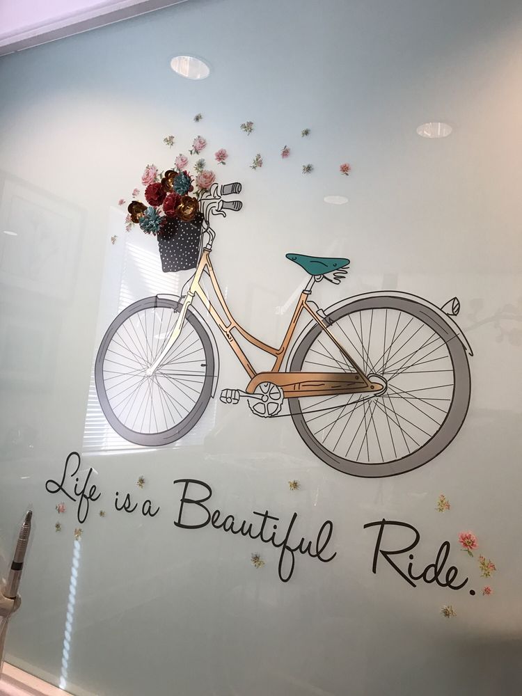 Colorful bicycle and flower artwork inside Garcia Dentistry Center